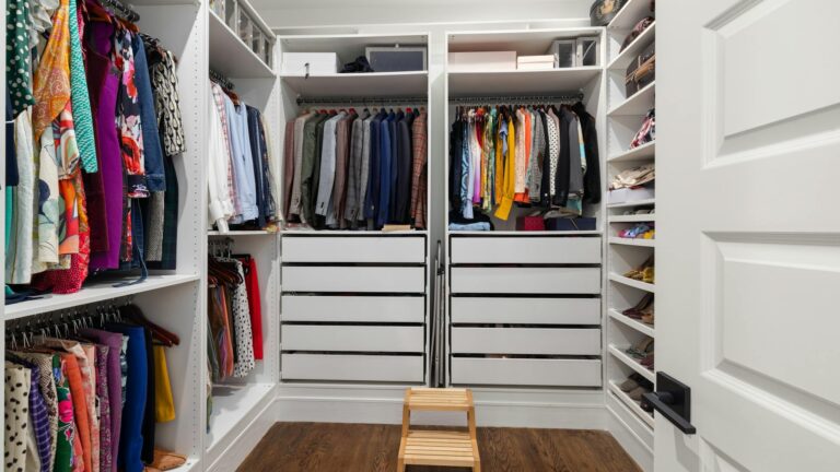 organized walk in closet with diverse clothing